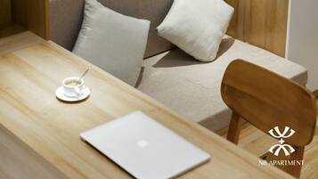 Deluxe Studio Suite | Premium bedding, desk, laptop workspace, blackout drapes