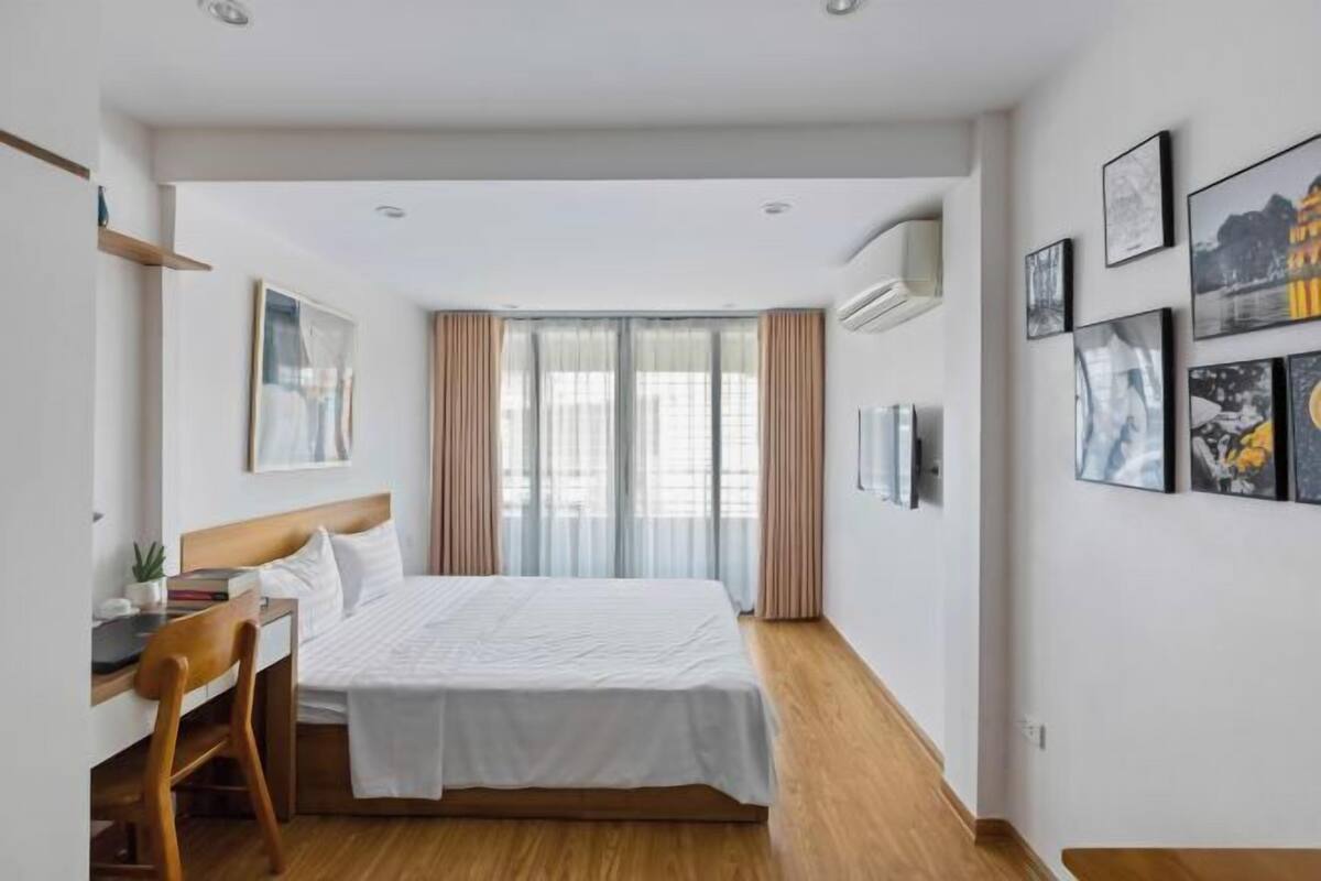 Premium bedding, desk, laptop workspace, blackout curtains