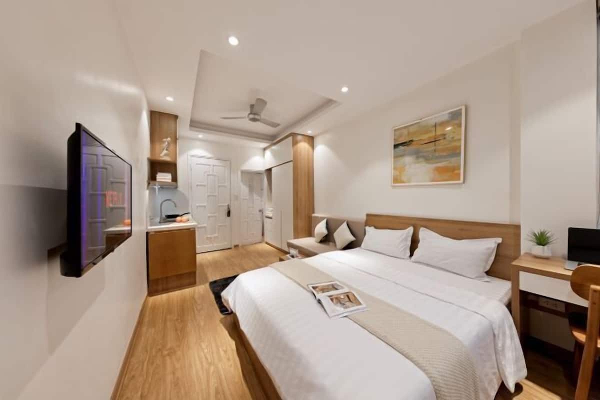 Premium bedding, desk, laptop workspace, blackout curtains
