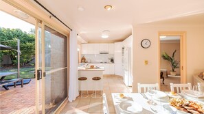 Enjoy meals in the kitchen with a dining area and access to a patio.