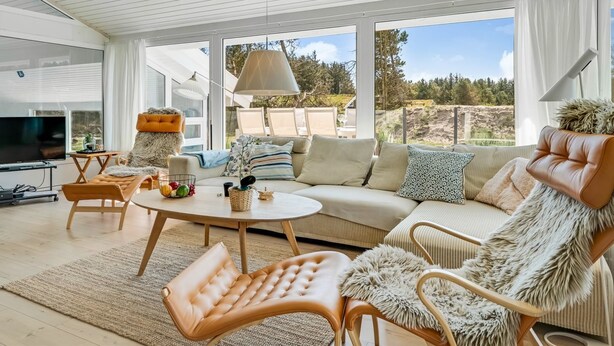 A modern living room with a sofa, chairs, a coffee table, and a TV. - "Gladis" - 900m from the sea by Interhome (Saltum)