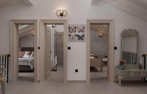 A hallway with a bedroom, a bathroom, and a vanity area. There are three doors leading to different rooms. - Beautiful home in Ugljan with sauna (Ugljan)