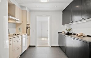 Fridge, stovetop, dishwasher, coffee/tea maker