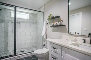 Shower, hair dryer, towels, shampoo