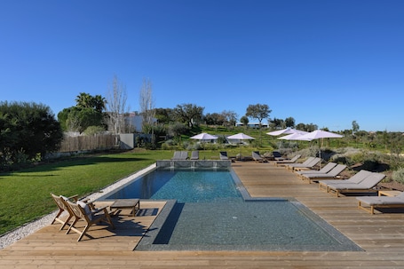 Outdoor pool, a heated pool, pool umbrellas, sun loungers