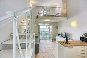Standard Apartment, Multiple Bedrooms, Sea Facing (Valdarke Seaside Apartment) | Living area | 21-inch flat-screen TV with cable channels