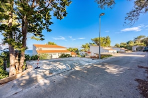 A residential area with houses, a street, and a clear sky.