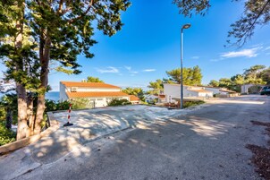 A residential area with houses, a street, and a clear sky.