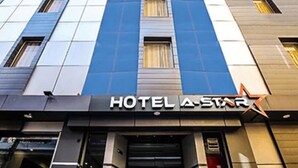 A hotel facade with a modern design, featuring a prominent 'HOTEL A-STAR' sign above the entrance. - Hotel A Star-50m away from Golden Temple (Amritsar)