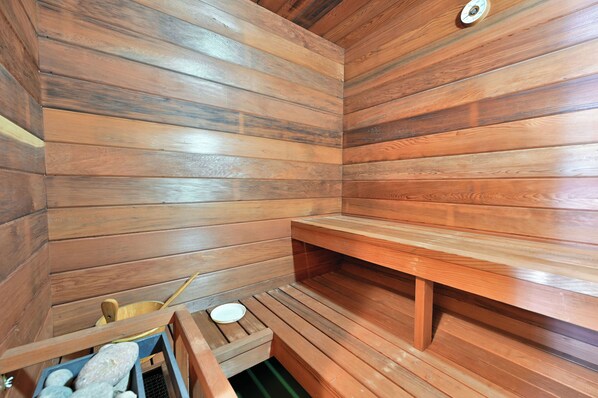 A sauna with wooden walls and benches.