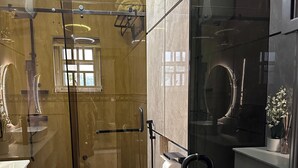 A modern bathroom with a glass shower enclosure, a toilet, and a sink. - Fully fitted 2 bedroom smart luxury apartment. (Abuja)