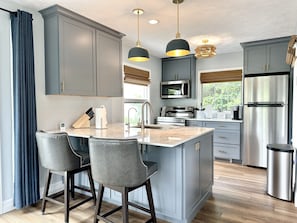 Fridge, microwave, oven, stovetop - Empire Beach House - Lake Michigan cottage with firepit, grill & furnished deck (Empire)