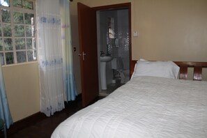 Standard Room | Bathroom | Rainfall showerhead, slippers, towels - Tranquil homestays (Naro Moru)