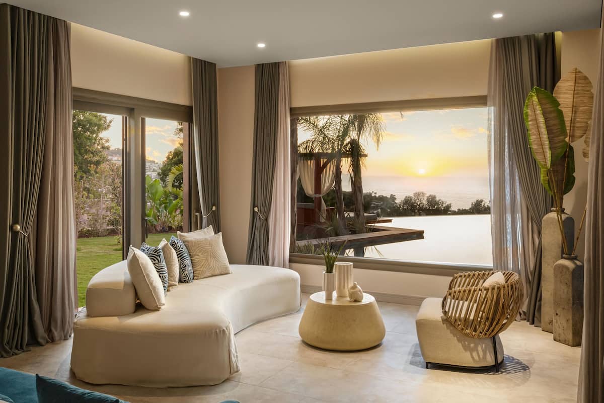 Swim Up Sunset Suite With Sea View | Living area | 55-inch Smart TV with digital channels