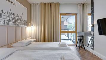 Ropa de cama hipoalergénica y tabla de planchar con plancha