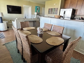Dining - Top floor condo looking out at West Bay and the heated Sunset Pool/Lazy River! (Galveston)