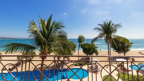 A pool area with a view of the beach and ocean. - Calm and Cosy 4 Bedroom Condo (Punta de Mita)