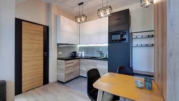 Studio Suite | Private kitchenette | Fridge, stovetop, dishwasher, coffee/tea maker