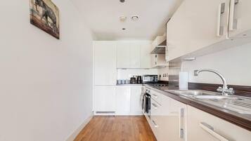 Apartment, 1 Queen Bed | Private kitchen | Fridge, microwave, oven, stovetop