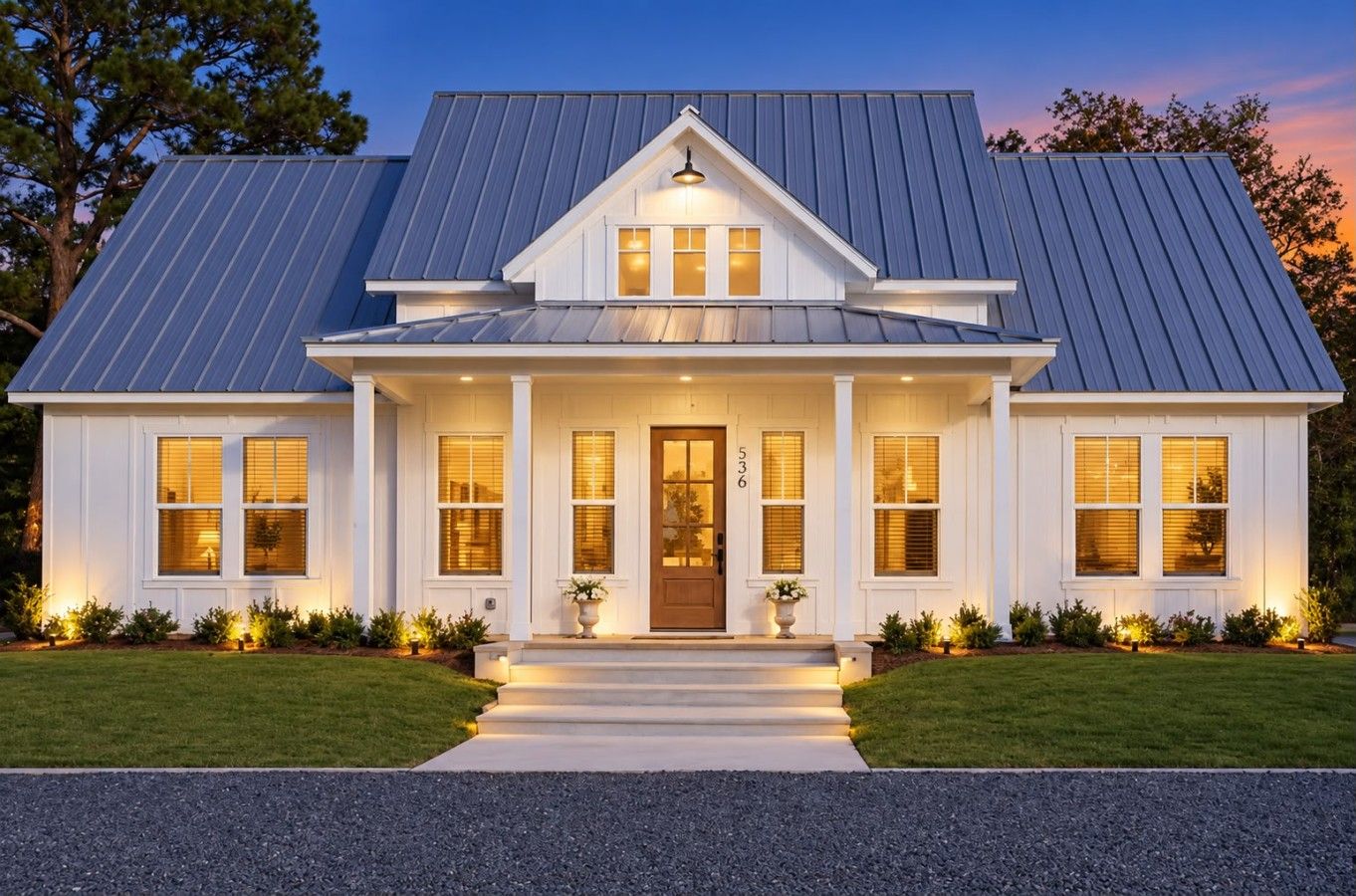 A two-story house with a front porch, a metal roof, and a number '536' on the door.