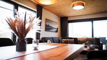 Deluxe Condo | Living area | 58-inch LED TV with digital channels, Netflix, first-run films