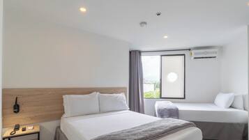 Basic Triple Room | Down comforters, desk, laptop workspace, free WiFi