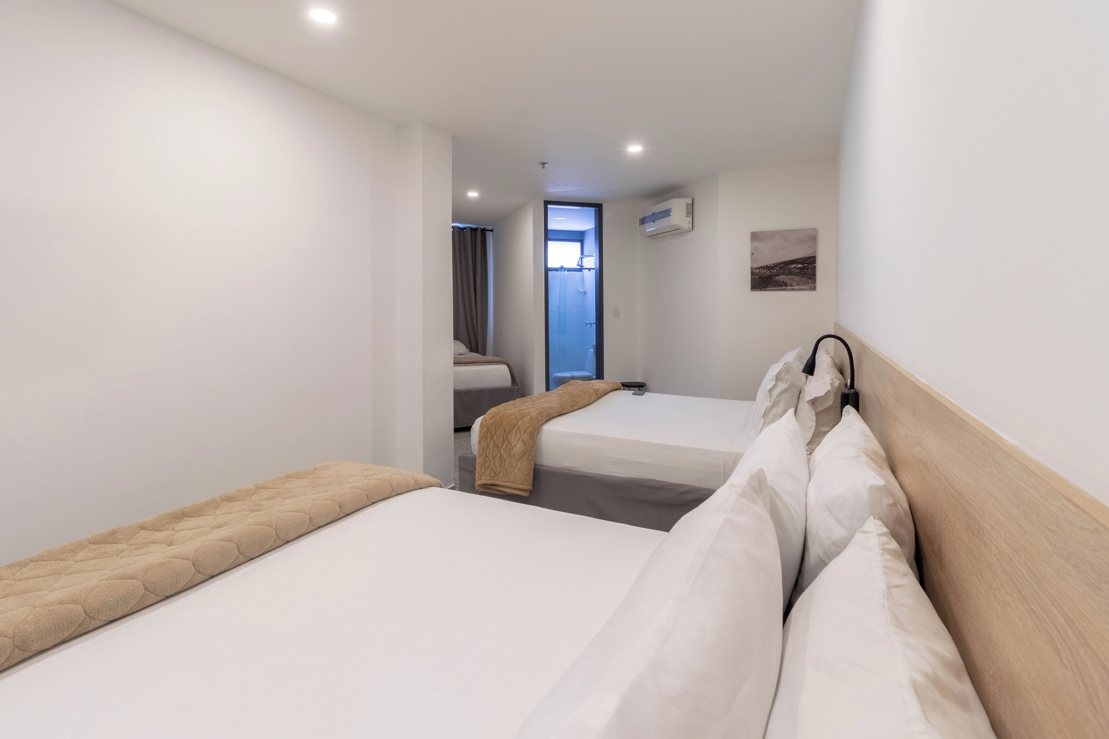 basic quadruple room | down duvets, desk, laptop workspace, free wifi