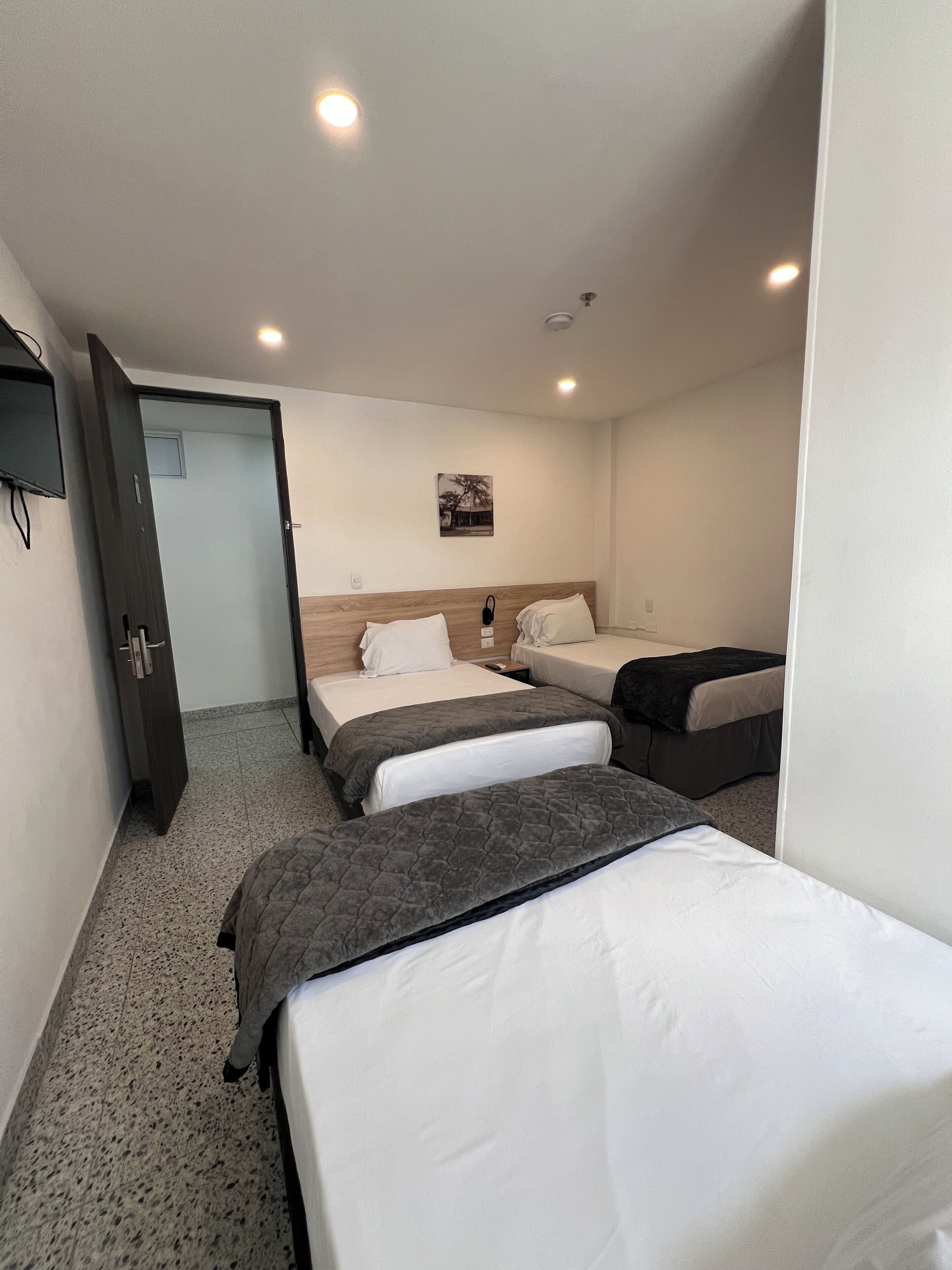 basic triple room | down duvets, desk, laptop workspace, free wifi