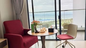 Deluxe Double Room, 1 King Bed, Ocean View | Minibar, in-room safe, desk, blackout drapes