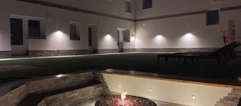 Enchanting apartment complex with a stunning yard, gym, and sports equipment.
