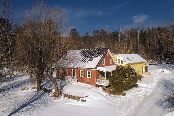 The 1820 House, a historic and updated farmhouse on Mountain Road — steps from the free ski shuttle to Stowe Mountain Resort