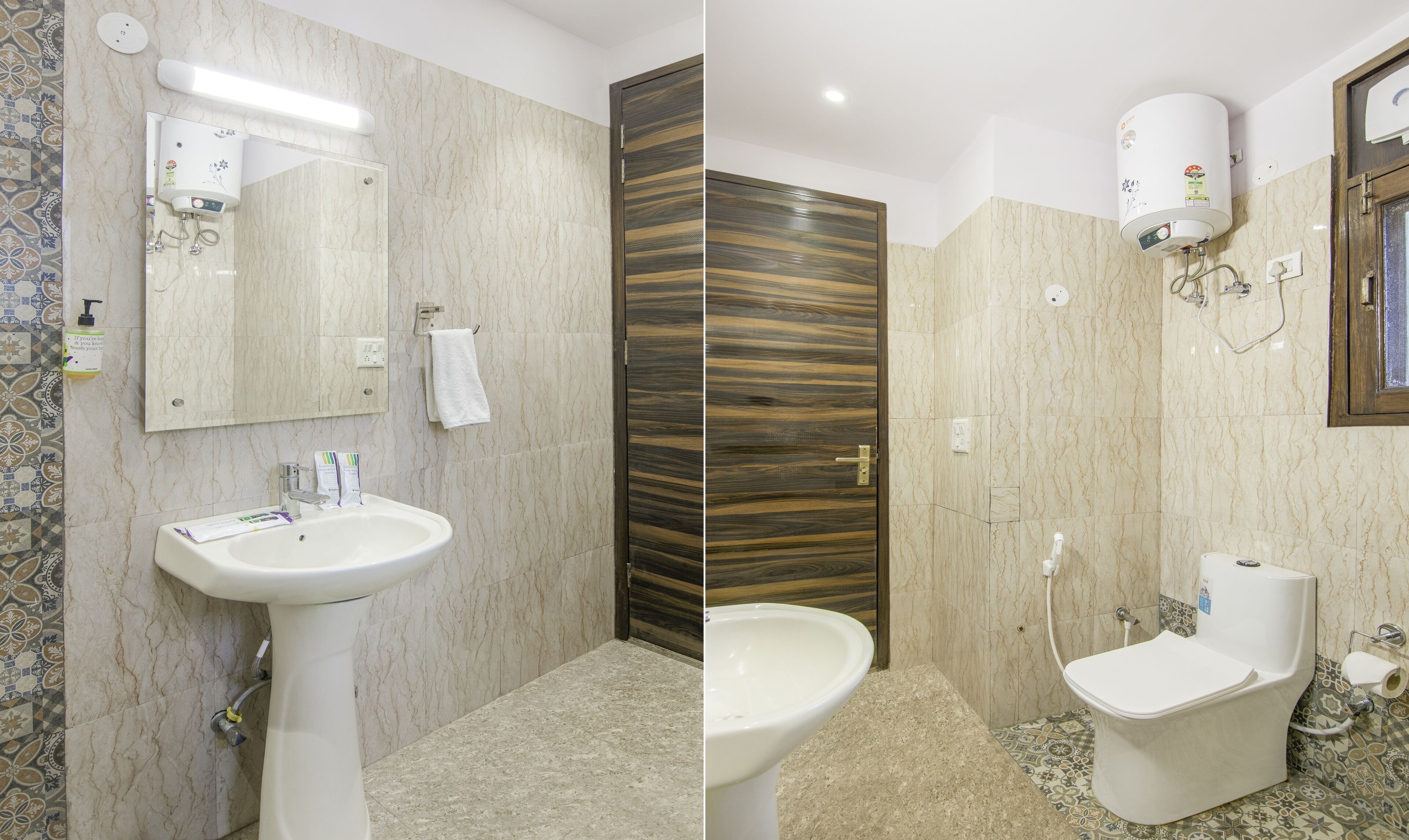 A bathroom with a white sink, a mirror, a towel rack, a toilet, and a shower with a control panel.