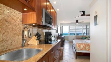 Condo (0 Bedroom) | Private kitchen | Full-sized fridge, microwave, oven, coffee/tea maker