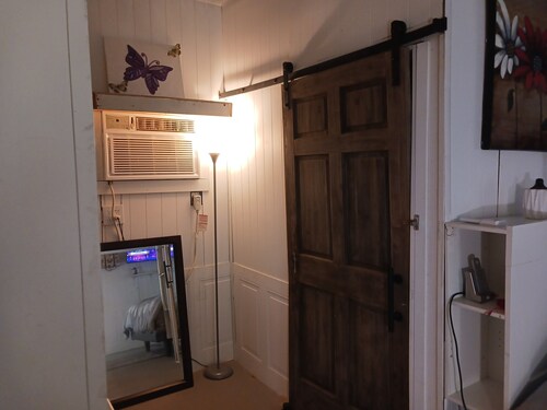 The Butterfly large Cabin with a king-size bed.  kitchenette and jacuzzi bathtub