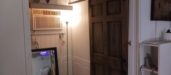 The Butterfly large Cabin with a king-size bed.  kitchenette and jacuzzi bathtub