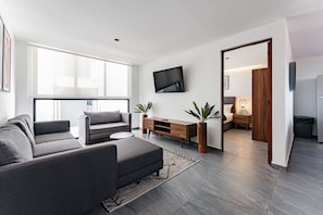 Suite Junior, terrazzo | Area soggiorno | Smart TV