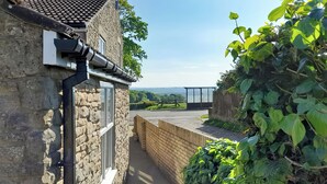 A narrow stone pathway leading to a wooden fence and a view of a distant landscape. - 3 bedroom accommodation in Fir Tree, near Crook (Fir Tree, near Crook)