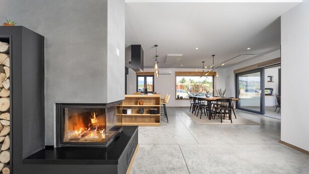 A modern living space with a fireplace, a dining area, and a kitchen with wooden shelves. - 3 bedroom awesome home in Krsan (Krsan)