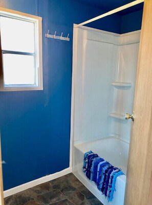 Shower, hair dryer, towels, soap