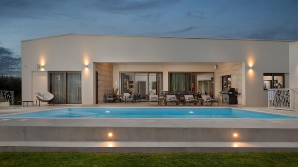 A modern house with a swimming pool, outdoor seating, and a barbecue area. - Nice home in Smokovic (Smokovic)