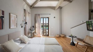 A bedroom with two beds, a desk, a chair, and a small table. - Amazing home in Sv. Lovrec (Sv. Lovrec)