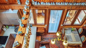 A cozy cabin interior with a dining area, a kitchen, and a living space. - Nice home in Wilcze with sauna (Wilcze)