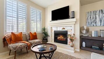 Smart TV, fireplace, books, offices