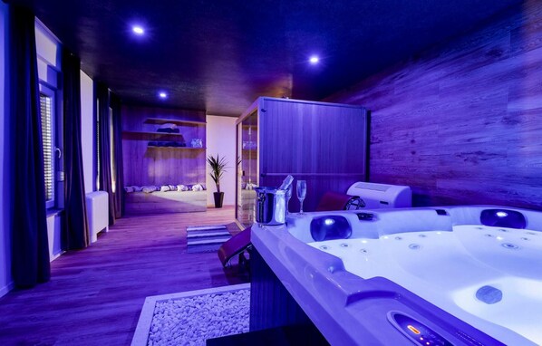 A modern spa room with a wooden interior, a hot tub, and a relaxation area with a view. - Amazing home in Nin with house sea view (Nin)