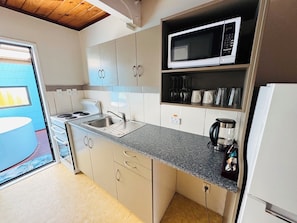 Family Apartment, 2 Bedrooms, Hot Tub | Private kitchen | Fridge, microwave, stovetop, electric kettle - Apex on Fenton (Rotorua)