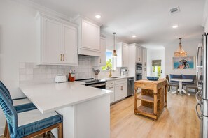 Fridge, microwave, oven, stovetop - "Nautilus Beach House" | Dog Friendly | Private Pool | Private Elevator | My Beach Getaways (Pensacola)