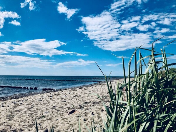 A beach with clear skies and calm waters.