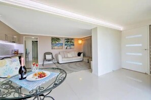 Living area - Executive Styled One bedroom ground floor apartment right on Bargara Esplanade (Bargara)