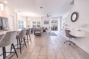 Enjoy a spacious open-plan living area with a dining space and kitchen, perfect for relaxing and cooking.