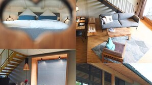 Ein modernes Interieur mit einem Bett, einem Essbereich und einer Treppe.